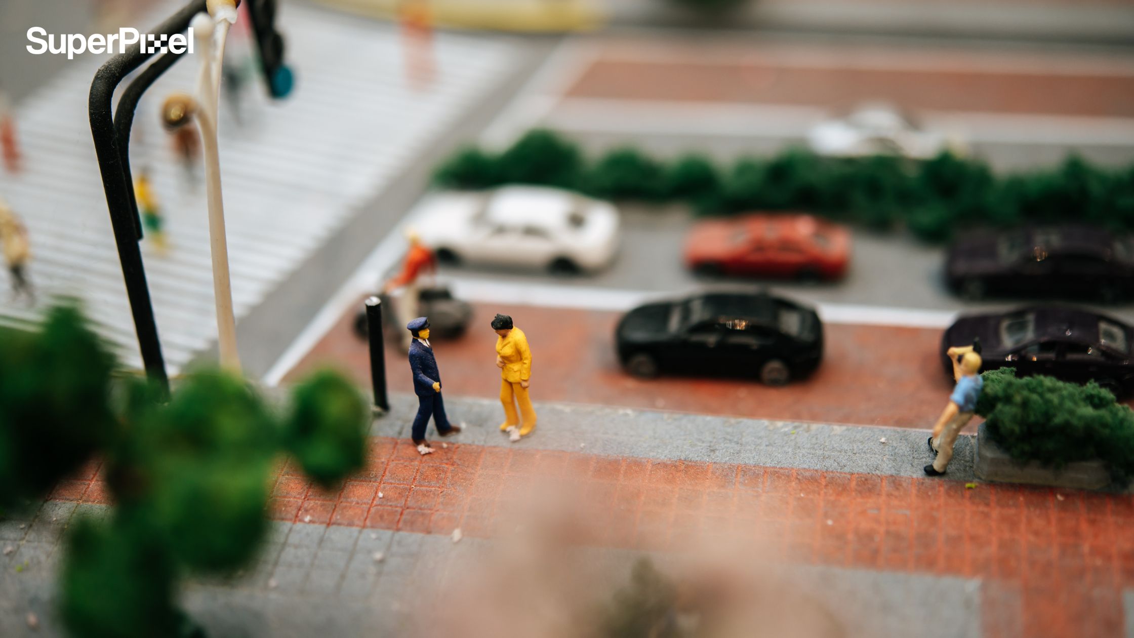 Close-up of miniature traffic police figures inspecting motorists as part of a stop motion animation services production.